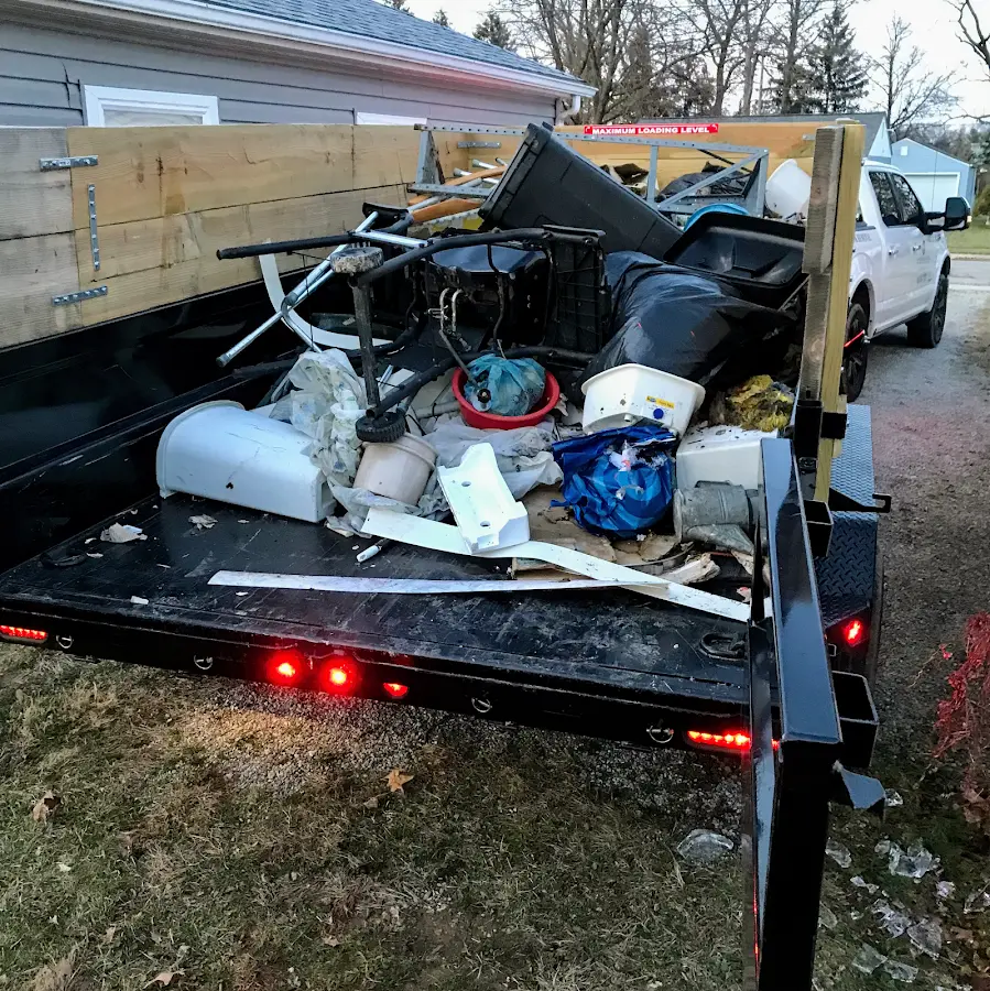 Roll-off dumpster delivered to a residential driveway in Madisonville